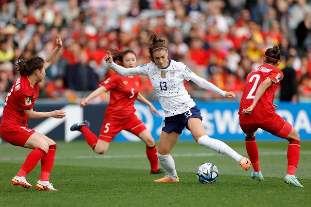 US forward Alex Morgan is surrounded by Vietnam defenders during their opening match at the Women's World Cup on Saturday, July 22, 2023. The United States, the two-time defending champs, won 3-0. (Photo by Carmen Mandato/USSF/Getty Images)