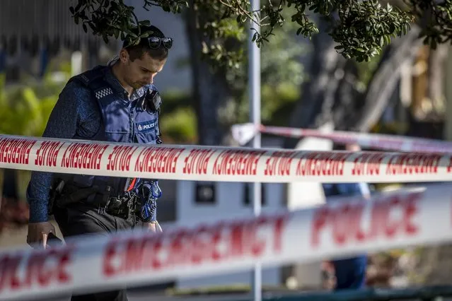 Police set up a cordon and search area in a suburb of Auckland following reports of multiple stabbings, in New Zealand, Thursday, June 23, 2022. Authorities say a man wounded some people in a stabbing rampage in a New Zealand city before bystanders brought him to the ground. (Photo by Michael Craig/New Zealand Herald via AP Photo)