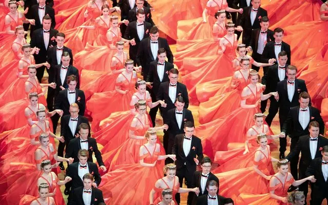 Debutant couples dance on the stage in the “Semper” opera house during the dress rehearsal for the 15th “Semperopernball” in Dresden, Germany on February 7, 2020. (Photo by Sebastian Kahnert/dpa via AP Photo)