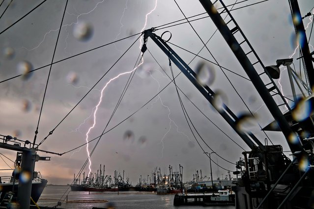 Lightning bolts strikes fall across the New Bedford fishing fleet as a storm rolls over the SouthCoast in Mass. on May 23, 2024. (Photo by Peter Pereira/The Standard-Times via USA TODAY Network)