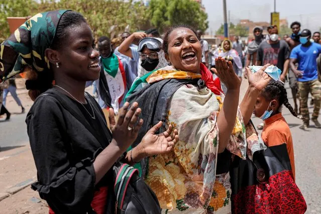 Women anti-coup protesters chant slogans during mass demonstrations against military rule in the centre of Sudan's capital Khartoum on June 30, 2022. At least six Sudanese demonstrators were killed as security forces sought to quash mass rallies of protesters demanding an end to military rule, pro-democracy medics said. In one of the most violent days this year in an ongoing crackdown on the anti-coup movement, AFP correspondents reported security forces firing tear gas and stun grenades to disperse tens of thousands of protesters. (Photo by AFP Photo/Stringer)