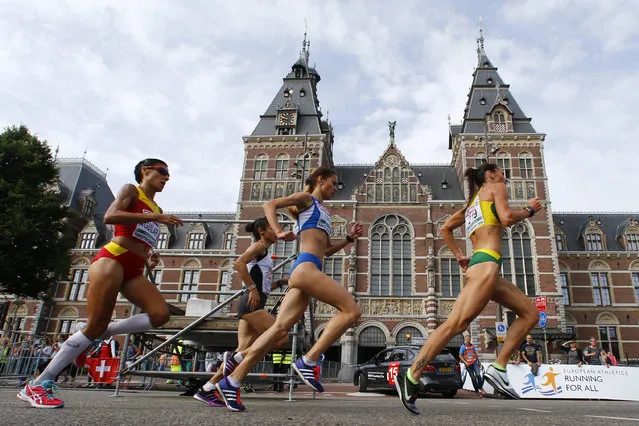 Athletes compete in front of the Rijksmuseum during the women half marathon final during the European Athletics Championships in Amsterdam, the Netherlands, Sunday, July 10, 2016. (Photo by Matthias Schrader/AP Photo)