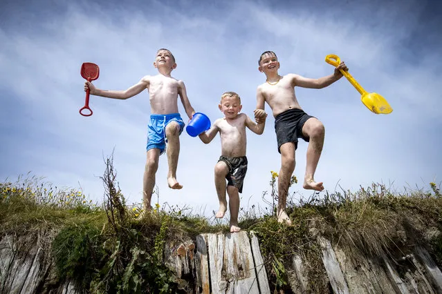Portmarnock Beach, Co Dublin on July 11, 2022. Brothers , Harry Finucane aged 9 Ollie Finucane aged 5 and Sam Finucane aged 11 from Shillelagh, Co Wicklow. (Photo by Tom Honan/The Irish Times)