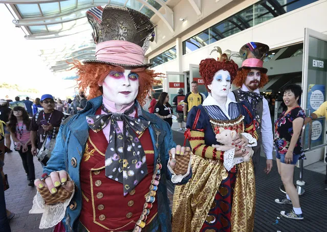 Members of the League of Hatters walk in front of the convention center on day one of Comic-Con International held at the San Diego Convention Center Thursday, July 21, 2016, in San Diego.  (Photo by Denis Poroy/Invision/AP)