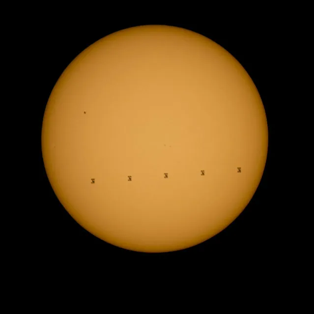 This composite image made from five frames shows the International Space Station, with a crew of nine onboard, in silhouette as it transits the sun at roughly five miles per second, Sunday, September 6, 2015, Shenandoah National Park, Front Royal, VA. Onboard are; NASA astronauts Scott Kelly and Kjell Lindgren: Russian Cosmonauts Gennady Padalka, Mikhail Kornienko, Oleg Kononenko, Sergey Volkov, Japanese astronaut Kimiya Yui, Danish Astronaut Andreas Mogensen, and Kazakhstan Cosmonaut Aidyn Aimbetov. (Photo by Bill Ingalls/NASA)