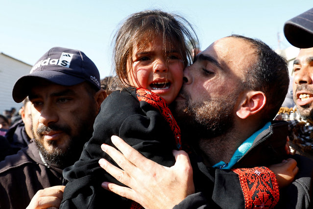 A freed Palestinian prisoner holds a child after being released by Israel as part of a hostages-prisoners swap and a ceasefire deal in Gaza between Hamas and Israel, in Khan Younis, in the southern Gaza Strip, on February 15, 2025. (Photo by Hatem Khaled/Reuters)