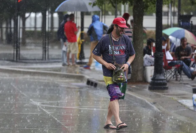 A heavy rain falls as Trump supporters line up and camp on 4th Street between Boulder Ave. and Cheyenne Ave. in downtown Tulsa, Okla., ahead of President Donald Trump's Saturday's campaign rally Friday, June 19, 2020. (Photo by Mike Simons/Tulsa World via AP Photo)