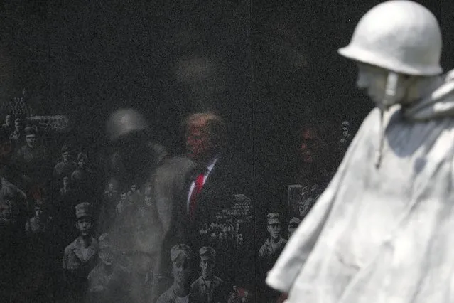 U.S. President Donald Trump and first lady Melania Trump are reflected in a memorial wall as they arrive for a wreath laying ceremony at the Korean War Veterans Memorial in Washington, U.S., June 25, 2020. (Photo by Tom Brenner/Reuters)