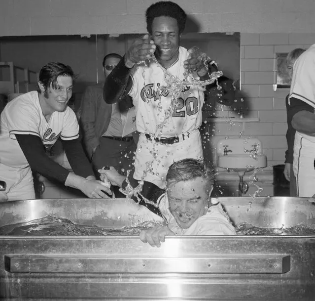 In this October 6, 1970, file photo, Frank Robinson, center rear, splashes water on Baltimore Orioles manager Earl Weaver as the Orioles celebrate sweeping the the Minnesota Twins to win the American League championship, in the clubhouse in Baltimore. Weaver’s Orioles were at their peak from 1969-71, when they won 109, 108 and 101 games. (Photo by AP Photo)