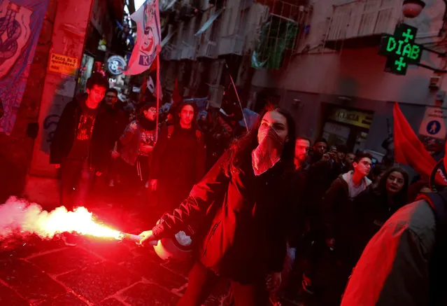 A student holds a flare during a protest in Naples, Italy December 15, 2017. (Photo by Tony Gentile/Reuters)