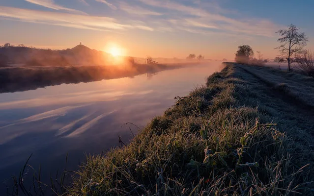 Misty river dawn, Glastonbury by Kevin Pearson. “My image was taken in late April along the bank of the river Brue in Glastonbury, Somerset. The flat, open, exposed landscape of the Somerset levels is punctuated by drainage channels and waterways, which give it a unique character. Cool evenings when followed by clear mornings tend to give rise to a blanket of mist rising off the water and grassland, creating an ethereal feel to the landscape, especially at sunrise before the mist burns away. You can see the frost still clinging to the grassy riverbank”. (Photo by Kevin Pearson/Weather Photographer of the Year 2016)