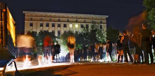 People queue up in front of the club Berghain in Berlin, Germany, August 28, 2016. For techno fans, a night at the legendary Berghain club is a must – if they can get in. Queues stretching for some one hundred metres are a regular sight outside the former power plant. Entrepreneurial locals do a roaring trade selling beers to those waiting. (Photo by Hannibal Hanschke/Reuters)