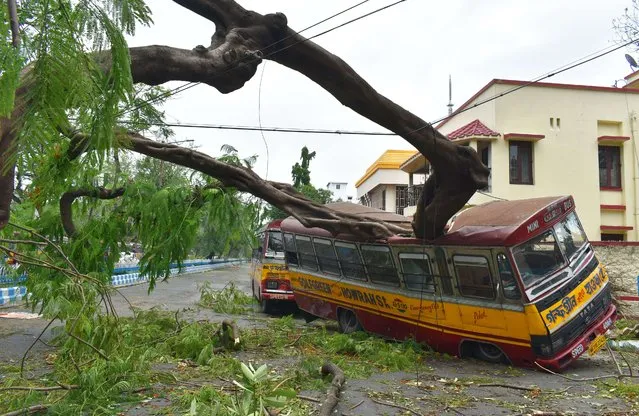 The eastern Indian city of Kolkata has been devastated by a powerful cyclone which has killed at least 84 people across India and Bangladesh. Amphan made landfall on Wednesday, lashing coastal areas with ferocious wind and rain. The storm is weakening as it moves north into Bhutan.Thousands of trees were uprooted in the gales, electricity and telephone lines brought down and houses flattened. Many of Kolkata's roads are flooded and its 14 million people without internet, power and telecommunication. (Photo by Sudipta Das/Pacific Press/Rex Features/Shutterstock)