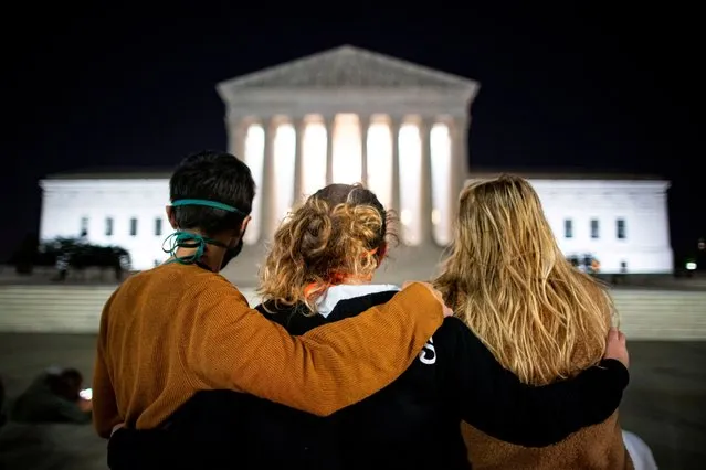 People stand in front of the U.S. Supreme Court following the death of U.S. Supreme Court Justice Ruth Bader Ginsburg, in Washington, U.S., September 18, 2020. (Photo by Al Drago/Reuters)
