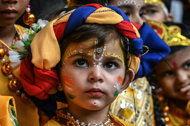 A child dressed as Hindu deity Krishna celebrates the Janmashtami festival in Amritsar on August 14, 2025. (Photo by Narinder Nanu/AFP Photo)