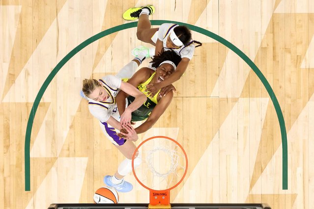 The Seattle Storm’s Nneka Ogwumike, center, battles Cameron Brink, left, and Rickea Jackson for a rebound during a WNBA game against the Los Angeles Sparks on Monday, September 1, 2025. (Photo by Steph Chambers/Getty Images)