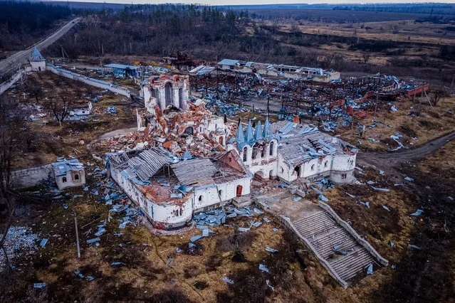 This aerial photograph taken on March 10, 2023, shows destroyed Svyato-Heorhiyivs'kyy Skyt during the fighting in summer and autumn 2022, in the village of Dolyna, Donetsk region, amid the Russian invasion of Ukraine. (Photo by Ihor Tkachov/AFP Photo)