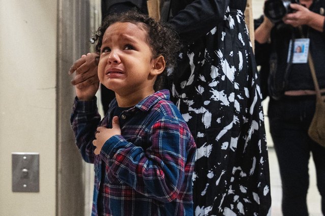 A child weeps and calls for his father who was detained by Federal immigration officers in a targeted detainment at a U.S. immigration court in Manhattan, New York City, on October 1, 2025. (Photo by David 'Dee' Delgado/Reuters)