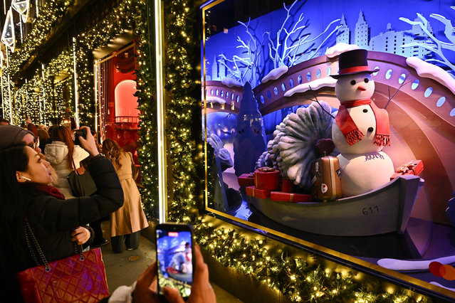 Saks Fifth Avenue holiday light show and window reveal on Monday, November 24, 2025, in New York. (Photo by Evan Agostini/Invision/AP Photo)