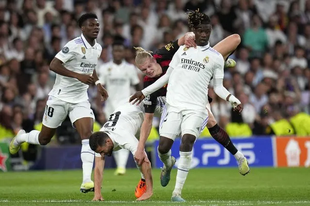 Manchester City's Erling Haaland, top center, is challenged by Real Madrid's Nacho during the Champions League semifinal first leg soccer match between Real Madrid and Manchester City at the Santiago Bernabeu stadium in Madrid, Spain, Tuesday, May 9, 2023. (Photo by Manu Fernandez/AP Photo)