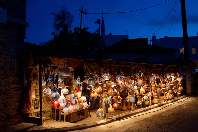 “Magic view”. It was already late evening on the way home. It was dark and silent almost everywhere on the turkish peninsula Bodrum. Suddenly we came to the small village Dereköy and saw this miraculous shop for lamps made from calabash. What a magic view.
Location: Dereköy, Bodrum, Westanatolia, Turkey. (Photo and caption by Thomas Richler/National Geographic Traveler Photo Contest)