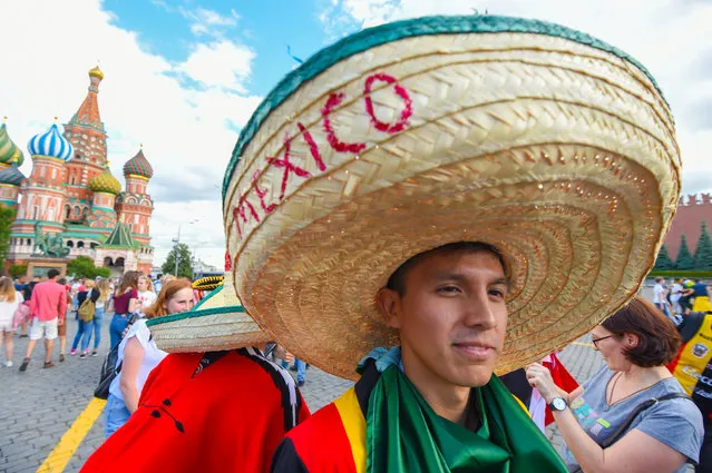 A Mexico fan walks at the Red Square in Moscow during the Russia 2018 World Cup football tournament, on June 21, 2018. (Photo by Patrik Stollarz/AFP Photo)