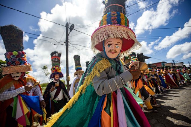 Men participate in the traditional dance of the “Toro Huaco” during the procession of the Tope de los Santos in the municipality of Diriamba, Nicaragua, 19 January 2025. The traditional dance of the “Toro Huaco”, is an ancestral dance that represents the cunning and rebellious spirit of Nicaraguans during the colonial era. (Photo by EPA/EFE/Stringer)