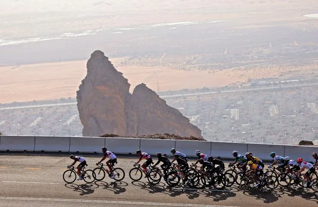 The pack rides during the third stage of the UAE Cycling Tour from Al Ain to Jebel Hafeet on February 23, 2021. (Photo by Giuseppe Cacace/AFP Photo)
