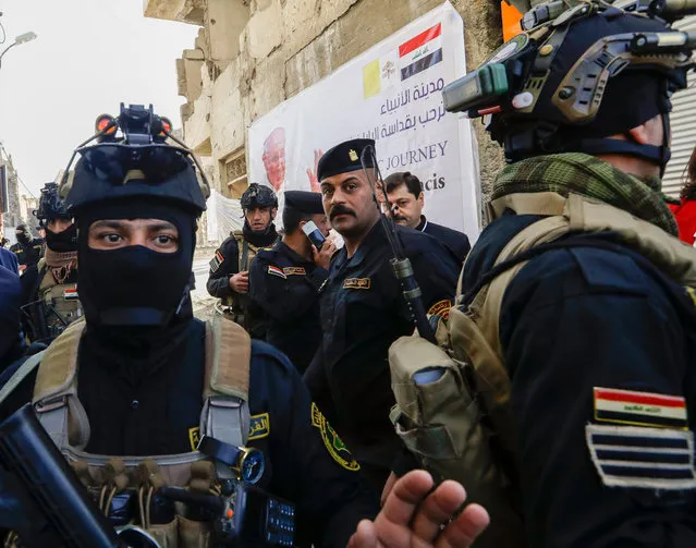 Iraqi security forces deploy in Mosul, northern Iraq, once the de-facto capital of IS, where Pope Francis will pray for the victims of war at Hosh al-Bieaa Church Square, Sunday, March 7, 2021. The long 2014-2017 war to drive IS out left ransacked homes and charred or pulverized buildings around the north of Iraq, all sites Francis will visit on Sunday. (Photo by Andrew Medichini/AP Photo)