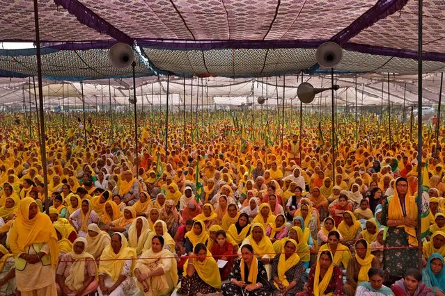 Women farmers attend a protest against farm laws on the occasion of International Women's Day at Bahadurgar near Haryana-Delhi border, India, March 8, 2021. (Photo by Danish Siddiqui/Reuters)