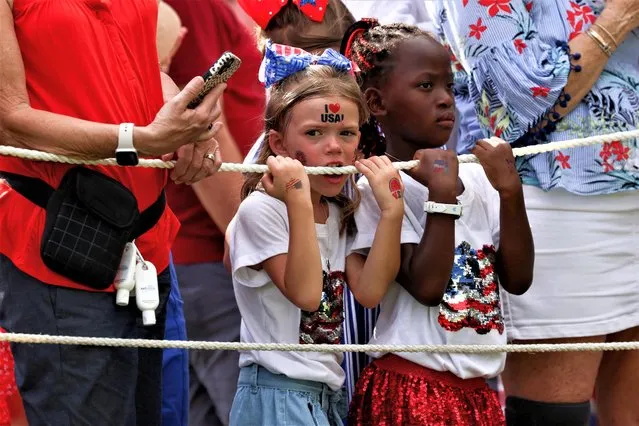 Children listen to speakers as U.S. President Joe Biden and first lady Jill Biden host a barbeque with active-duty military families on the South Lawn at the White House in Washington, U.S., July 4, 2023. (Photo by Julia Nikhinson/Reuters)