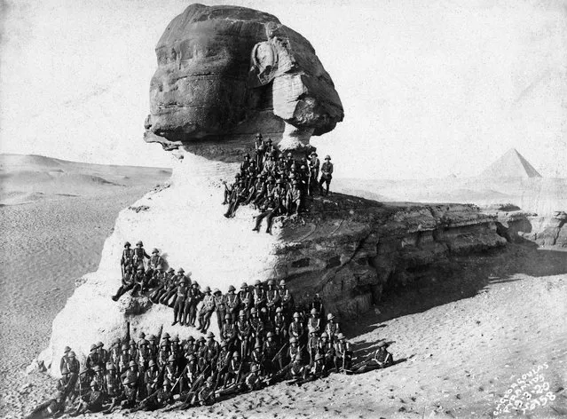 Infantymen pose for a photograph on the Great Sphinx, built around 2,500 B.C., at Giza, in Egypt. March, 1920. (Photo by Michael Nicholson/Corbis via Getty Images)