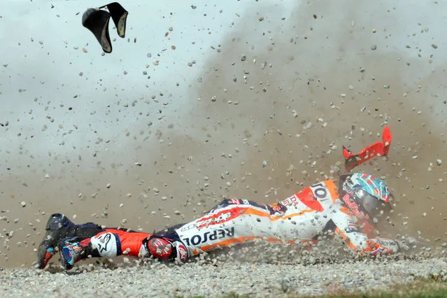 Honda Spanish rider Marc Marquez crashes during the first MotoGP free practice session of the Moto Grand Prix of Catalonia at the Circuit de Catalunya on September 1, 2023 in Montmelo on the outskirts of Barcelona. (Photo by LLuis Gene/AFP Photo)