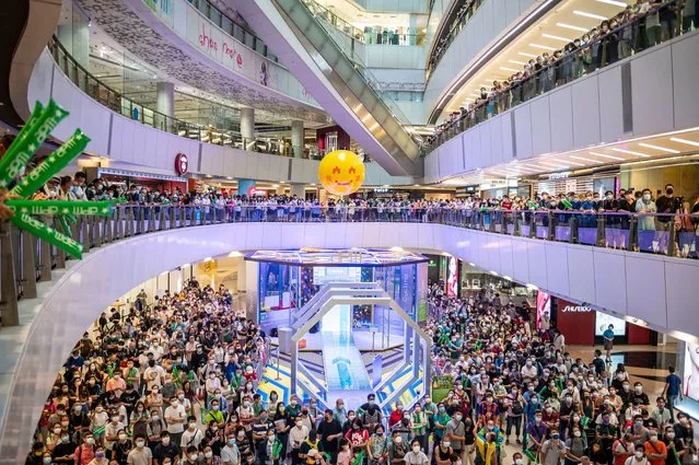 People react as they watch Siobhan Bernadette Haughey of Hong Kong swim in the women's 100-meter freestyle final at the 2020 Summer Olympics, at a shopping mall in Hong Kong, Friday, July 30, 2021. Haughey, born in Hong Kong four months after the 1997 handover, now has two silver medals from Tokyo, becoming the city's first-ever multiple medalist. Hong Kong's haul of treasure from Tokyo, with a gold also won in men's fencing, outshines the one gold, one silver and one bronze that Hong Kong accumulated through all of its previous Olympic appearances since its 1952 debut at the Helsinki Games. (Photo by Vernon Yuen/NurPhoto/Rex Features/Shutterstock)