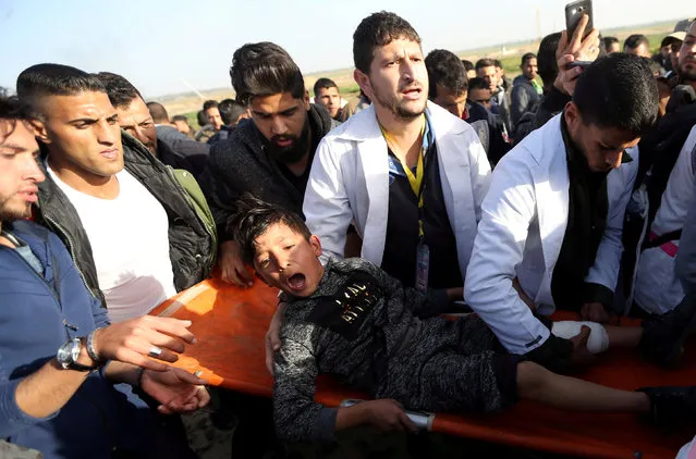 A wounded Palestinian boy shouts as he is evacuated during a protest at the Israel-Gaza border fence, in the southern Gaza Strip January 25, 2019. (Photo by Ibraheem Abu Mustafa/Reuters)