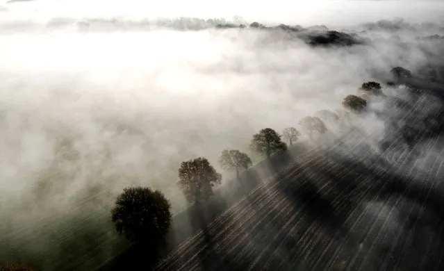 Ploughed fields are shrouded in fog, Keele, Staffordshire, Britain on November 28, 2023. (Photo by Carl Recine/Reuters)