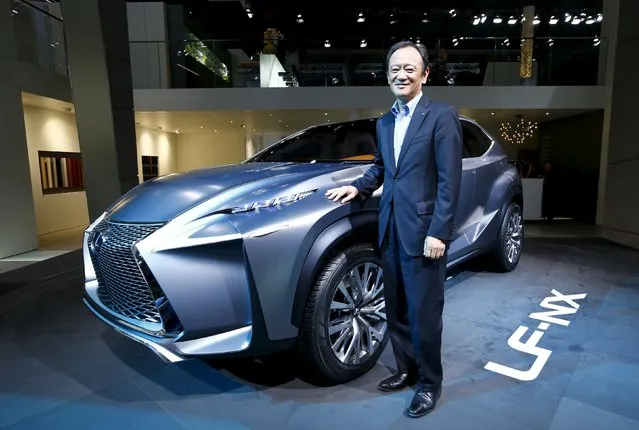 Tokuo Fukuichi, executive vice president of Lexus, poses next to a Lexus LF-NX mid-size crossover concept during a media preview day at the Frankfurt Motor Show (IAA) in this September 10, 2013 file photo. Big may be beautiful, but Toyota Motor Corp's global design chief is betting that edgy is the way to go for the Japanese automaker's premium Lexus brand, specifically its signature “spindle grille” design. (Photo by Ralph Orlowski/Reuters)