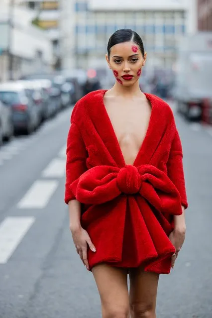 Cindy Kimberly with kiss lip make up wears red dress outside Viktor&Rolf during the Haute Couture Spring/Summer 2024 as part of Paris Fashion Week on January 24, 2024 in Paris, France. (Photo by Christian Vierig/Getty Images)