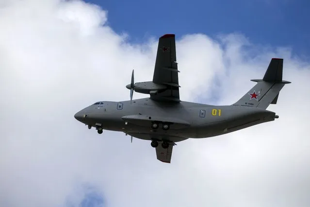 The new light military transport plane, Il-112V flies over the Voronezh Aircraft Production Association airfield outside Vorozh, Russia, in this photo dated Tuesday, March 30, 2021. A prototype military transport plane crashed while performing a test flight outside Moscow on Tuesday Aug. 17, 2021, Russian news agencies reported, citing Russia's United Aircraft Corporation. The new light military transport plane, Il-112V, crashed in a forested area as it was coming in for a landing at the Kubinka airfield about 45 kilometers (28 miles) west of Moscow, spokespeople of the corporation told the Tass news agency. (Photo by Marina Lystseva/AP Photo)