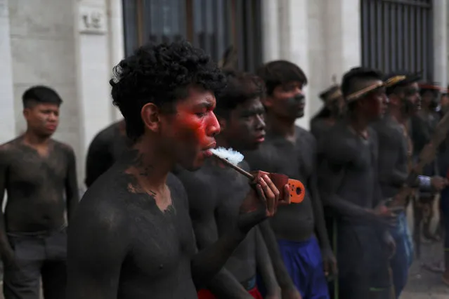 Indigenous from the Guarani tribe are seen during a protest for better health care services in front of the Sao Paulo city hall, Brazil, March 28, 2019. (Photo by Amanda Perobelli/Reuters)