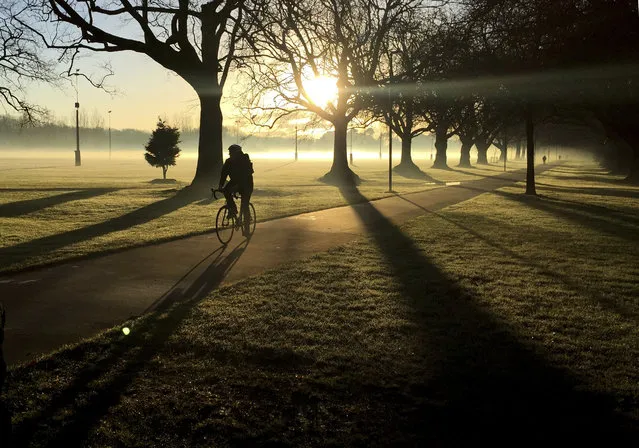 In this June, 26, 2017, file photo, a cyclist makes his way through a mist covered Hagley Park in central Christchurch, New Zealand. Despite its tranquility and beauty, New Zealand city of Christchurch is painfully familiar with trauma and will need to use that experience to recover from terrorist attack. (Photo by Mark Baker/AP Photo)