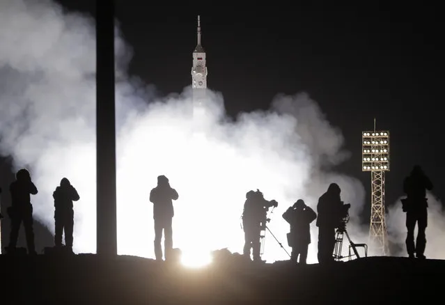 The Soyuz-FG rocket booster with Soyuz MS-03 space ship carrying a new crew to the International Space Station, ISS, blasts off at the Russian leased Baikonur cosmodrome, Kazakhstan, Friday, November 18, 2016. The Russian rocket carries French astronaut Thomas Pesquet, Russian cosmonaut Oleg Novitsky and U.S. astronaut Peggy Whitson. (Photo by Dmitri Lovetsky/AP Photo)