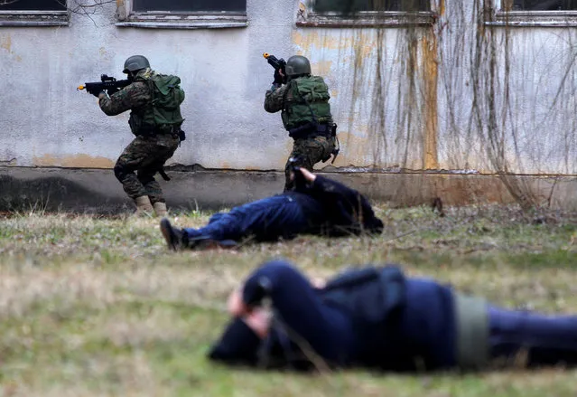 Macedonian Army and Police special forces perform an exercise after finishing their three-week training with the U.S. Navy Seals in Skopje, Macedonia February 13, 2017. (Photo by Ognen Teofilovski/Reuters)