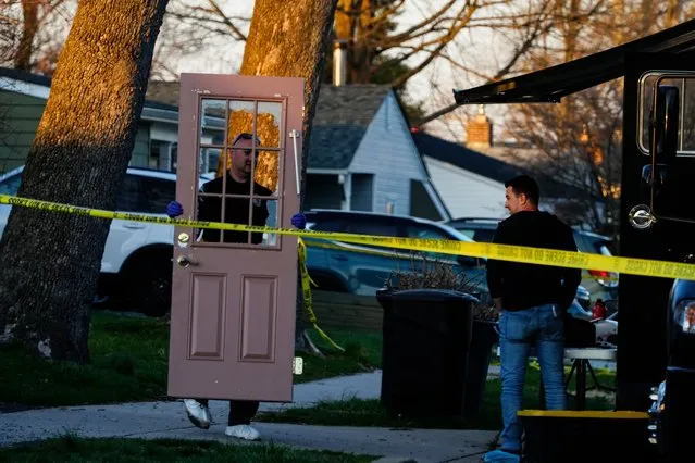 An investigator collects evidence from the scene of a fatal shooting in Levittown, Pa., Saturday, March 16, 2024. Police say a man suspected of killing multiple family members in the Philadelphia area has been arrested in New Jersey. (Photo by Matt Rourke/AP Photo)
