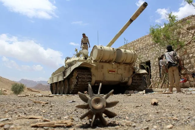 Yemeni pro-government forces, loyal to fugitive President Abedrabbo Mansour Hadi, gather at the military base of Nehm, in the Sanaa province east of the Yemeni capital, the frontline with the Marib region on April 7, 2016. Pro-government forces, backed by a Saudi-led coalition battling the Shiite Huthi rebels for more than a year, have retaken most of the eastern Marib province from the  Huthi insurgents and their allies. However, the rebels still control northern and western parts of the oil-rich Marib province east of the capital Sanaa, which has been held by the Huthis since September 2014. (Photo by Nabil Hassan/AFP Photo)
