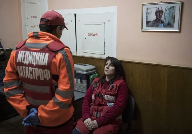 Medics gather in a building at a compound of the Stepova coal mine after a methane gas explosion in Lviv region, Ukraine, March 2, 2017. (Photo by Vladyslav Musiienko/Reuters)