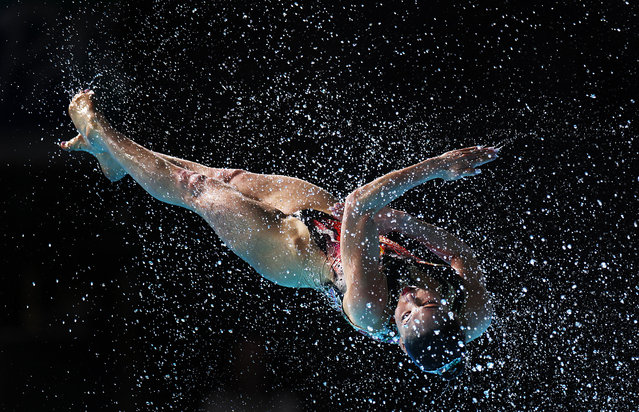 Team Kazakhstan throw Zhaklin Yakimova of Kazakhstan into the air while they perform their routine in the Mixed Team Acrobatic during the World Aquatics Artistic Swimming World Cup 2024 - Stop 2 at Aquatics Centre on May 05, 2024 in Paris, France. (Photo by Adam Pretty/Getty Images)