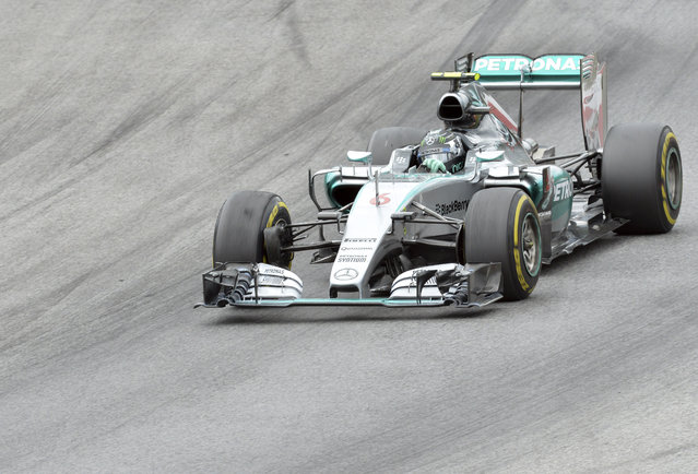 Mercedes driver Nico Rosberg of Germany steers his car during the Austrian Formula One Grand Prix race at the Red Bull Ring  in Spielberg, southern Austria, Sunday, June 21, 2015. (AP Photo/Kerstin Joensson)