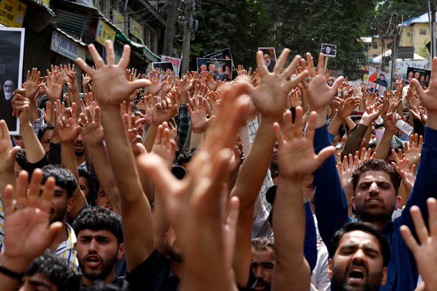 Shiite Muslims react as they attend a commemoration ceremony of late Iranian President Ebrahim Raisi, in Budgam on the outskirts of Srinagar on May 24, 2024. (Photo by Sharafat Ali/Reuters)