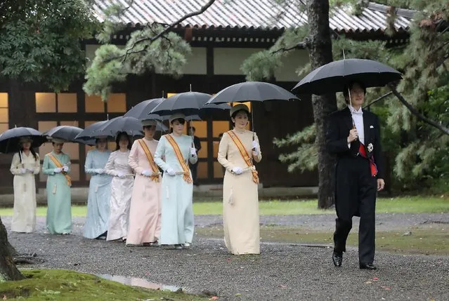 Imperial family members arrive at Kshikodokoro, Imperial Palace Sanctuaries, in Tokyo on October 22, 2019. The Sokuirei-Tojitsu-Kashikodokoro-Omae-no-gi Ceremony for the Emperor to report to his ancestors the conduct of the Sokuirei was held at the place. The “Sokuirei-Seiden-no-Gi” enthronement proclamation ceremony, and Kyoen-no-gi, Court banquets to celebrate the enthronement will be held on the same. Total costs for enthronement-related ceremonies reach 16,085 million yen. (Photo by JIJI Press/AFP Photo)